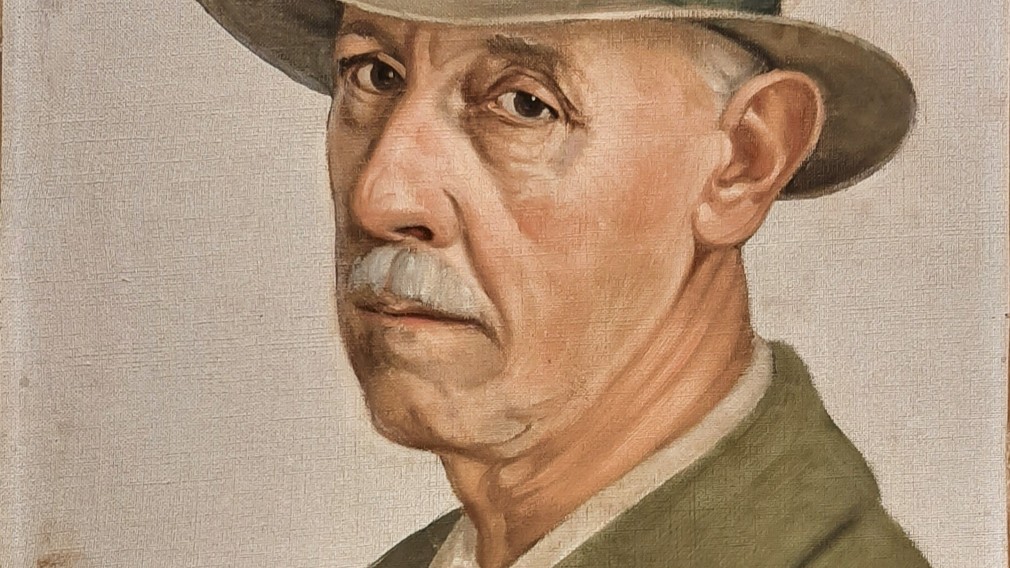 Ein Gemälde, auf dem das Selbstporträt des Gründungsobmannes des St. Pöltner Künstlerbundes Adolf Peschek, zu sehen ist.